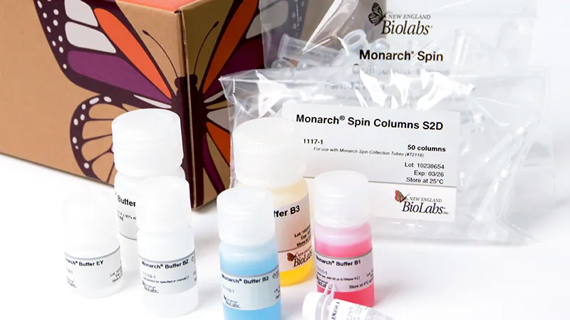 Crop of Monarch® Spin Plasmid Miniprep Kit box with plastic bag of columns and bottles with colored buffers
